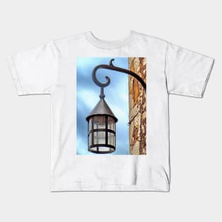 Lighting the way in Eze Kids T-Shirt